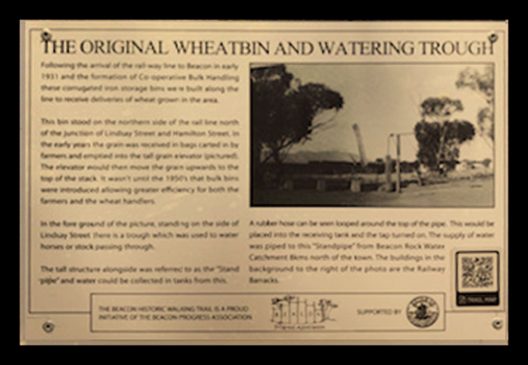 A Historic Walking Trail plaque of the original Beacon Wheat bin